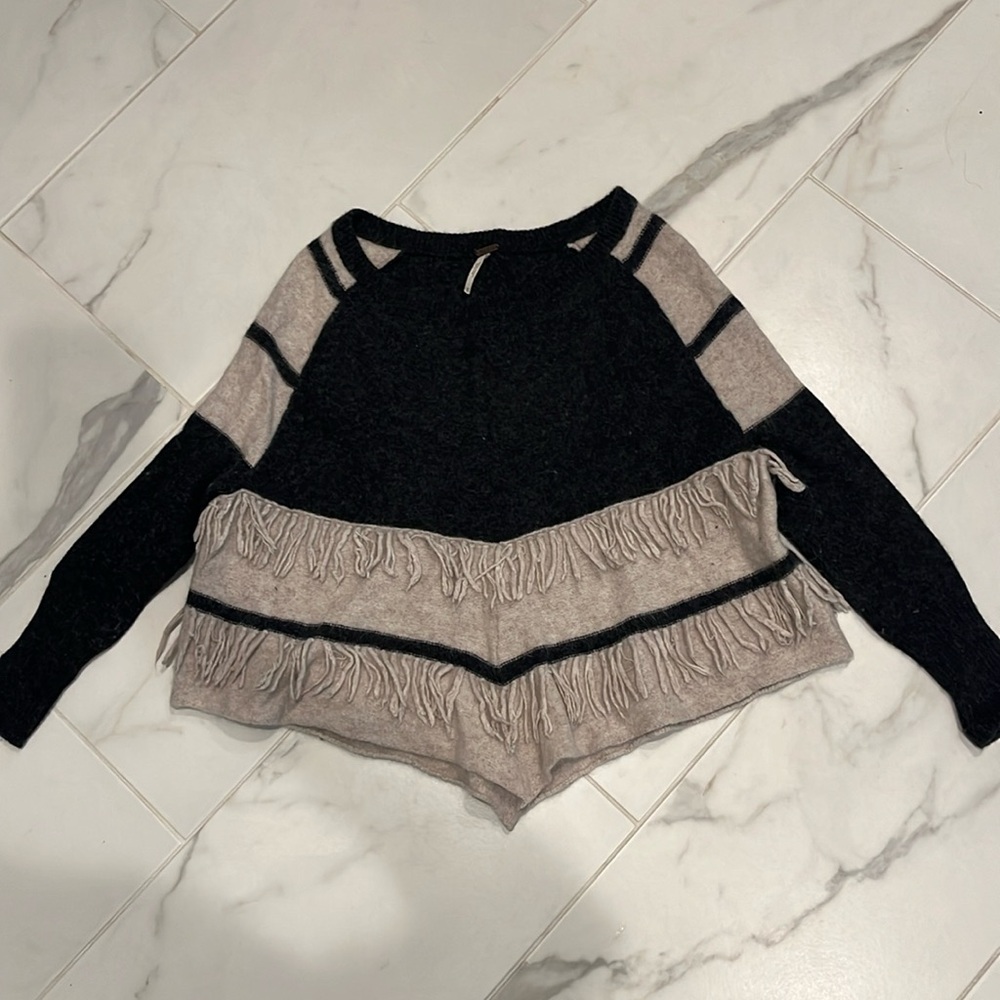 Free People size extra small poncho sweater. 60% lambs wool. Fun fringe detail.